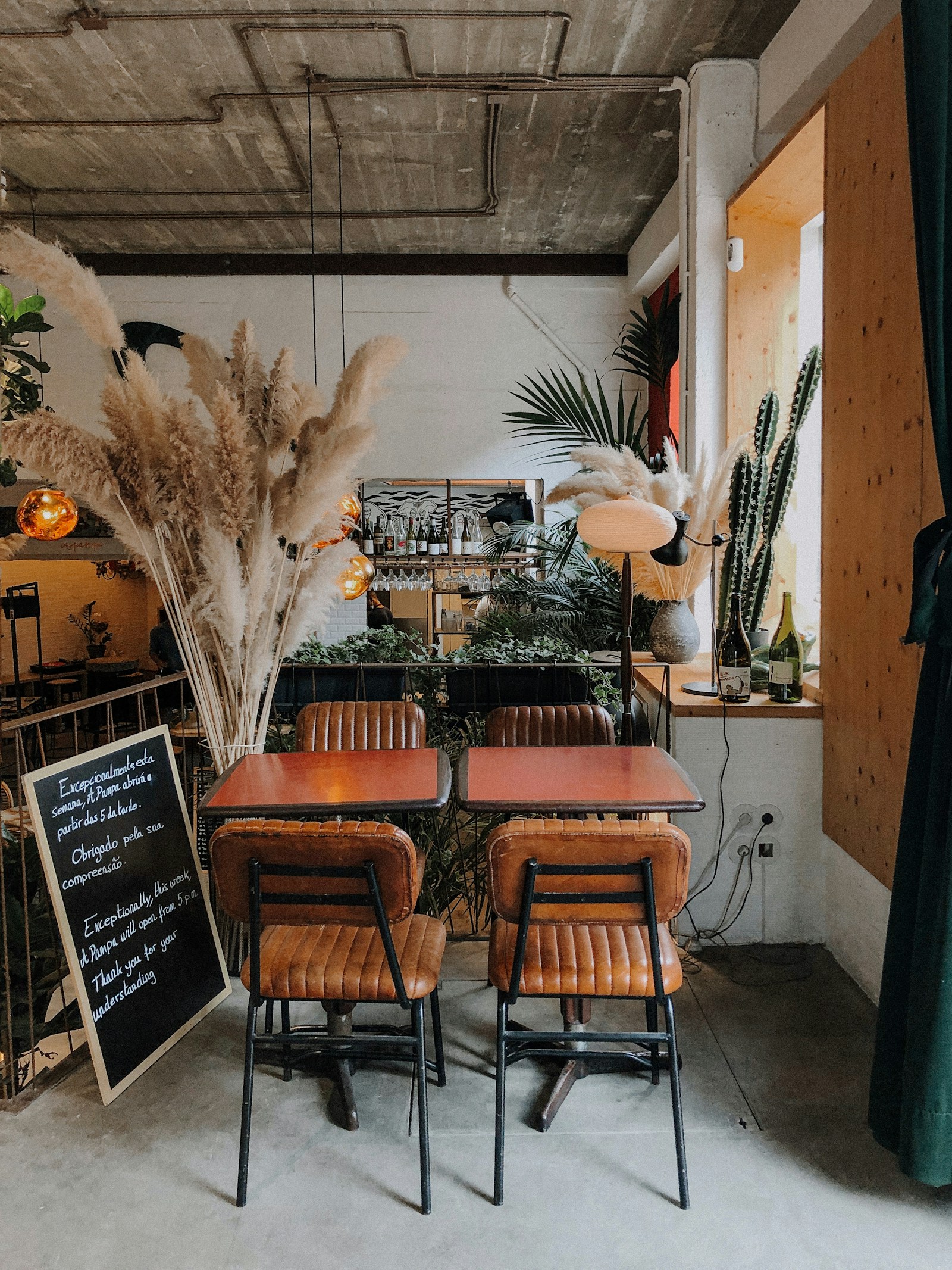Illustrative Lisbon restaurant interior with warm lighting and plants